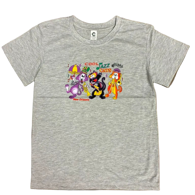 A heather gray short-sleeve t-shirt featuring a colorful cartoon graphic of 'The Powerpuff Girls' on the chest, laid flat on a dark wood floor.