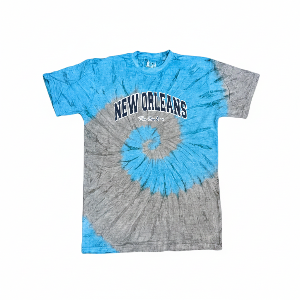 A short-sleeve crewneck t-shirt featuring a spiral tie-dye pattern in bright blue and heather gray. The front has 'NEW ORLEANS' printed in arched black letters with white outlines across the chest.