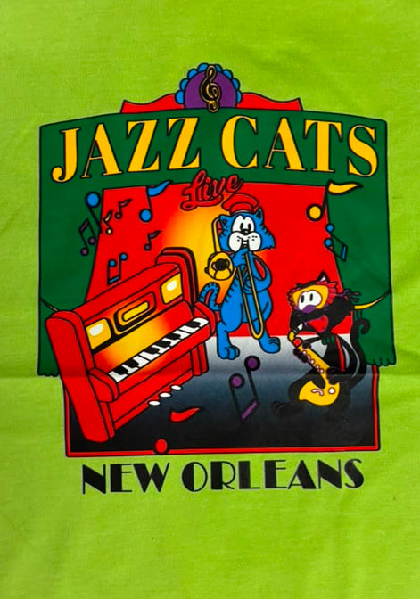 A lime green cotton t-shirt featuring a colorful graphic print of the 'Jazz Cats' band performing in New Orleans