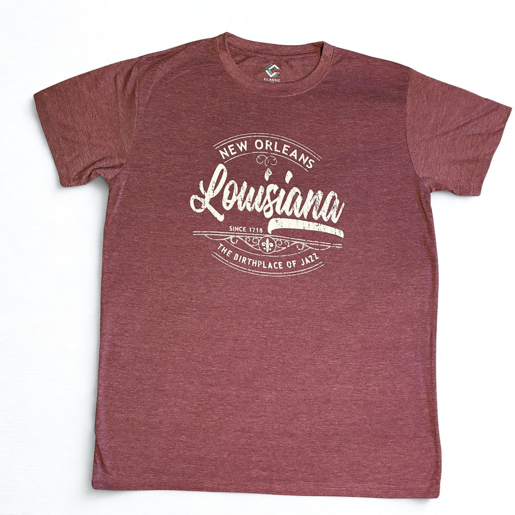 A heathered burgundy short-sleeve t-shirt with a vintage-style white graphic on the chest that reads 'New Orleans Louisiana The Birthplace of Jazz'.