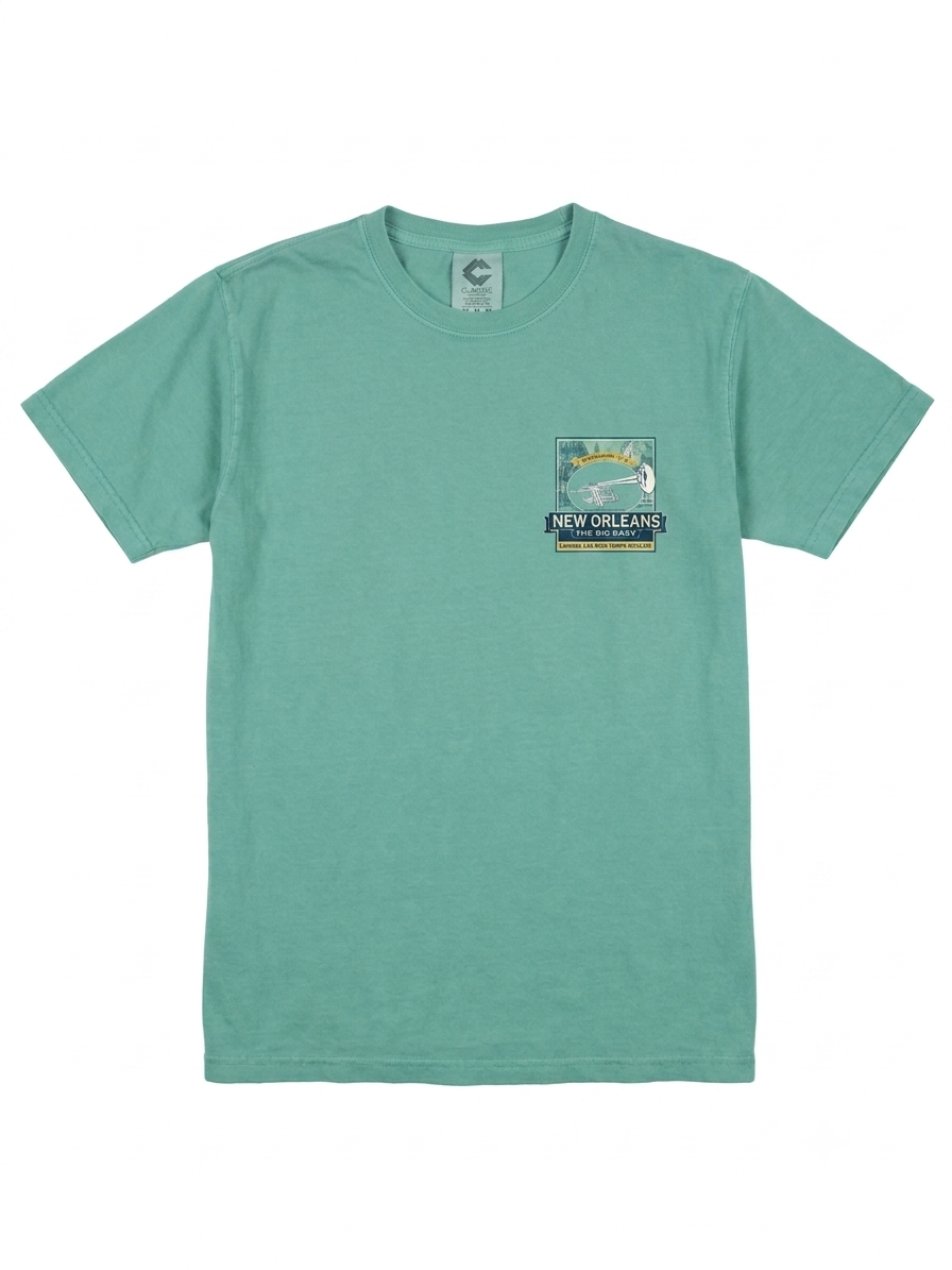 A mint green short-sleeve crewneck t-shirt with a small graphic print on the left chest depicting a trumpet and the text 'NEW ORLEANS'.