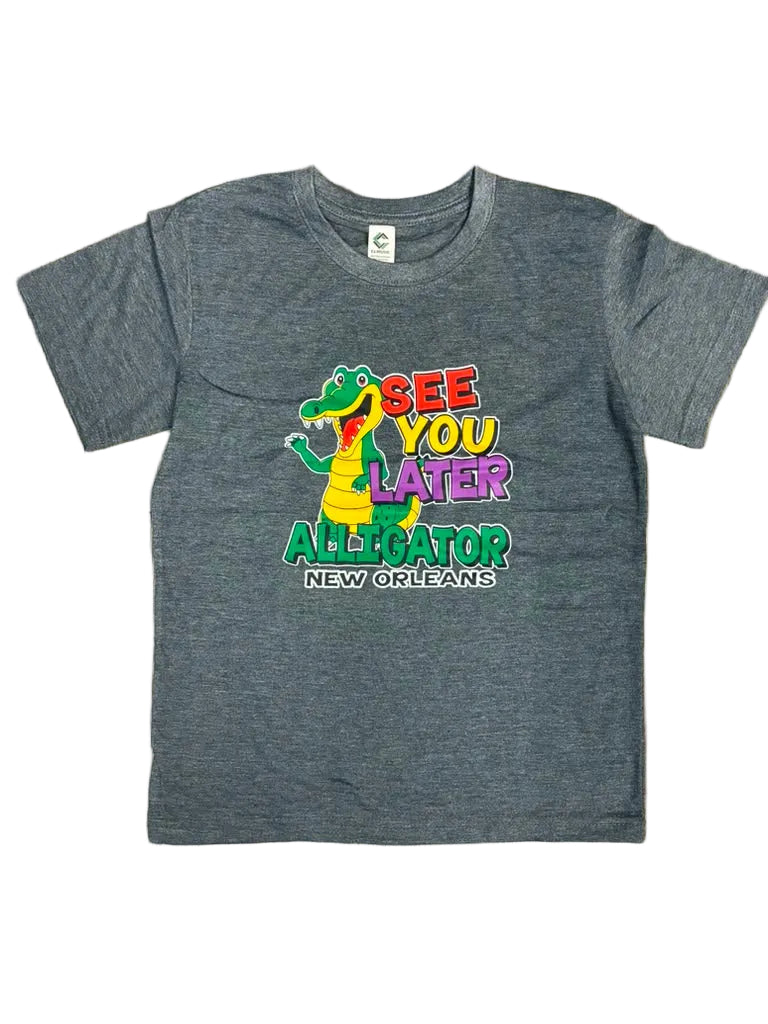 A heather gray short-sleeve t-shirt laid flat on a white background, featuring a colorful graphic of a green alligator and the text 'SEE YOU LATER ALL OVER NEW ORLEANS'.