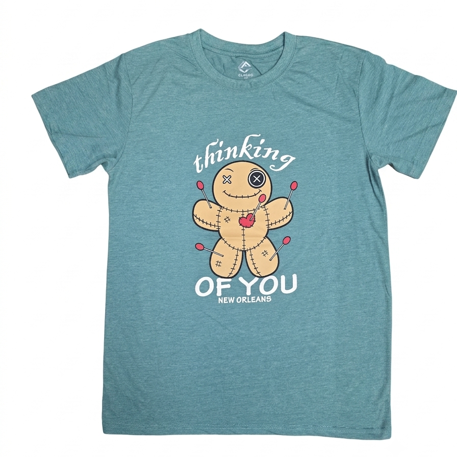 A heather teal blue short-sleeve t-shirt with a graphic of a stitched voodoo doll and the text 'thinking OF YOU NEW ORLEANS' printed on the front.