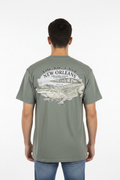 Male model wearing green gator tee