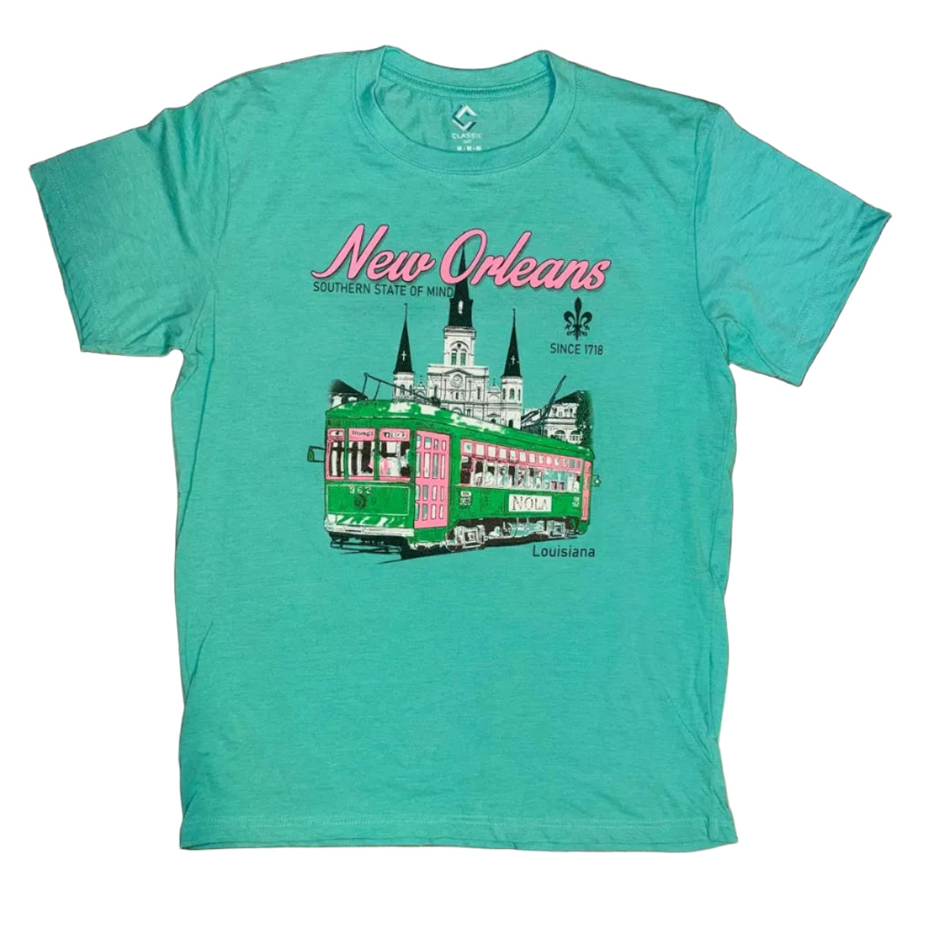 A turquoise crewneck t-shirt featuring a New Orleans graphic print with a green streetcar and pink script text, laid flat.