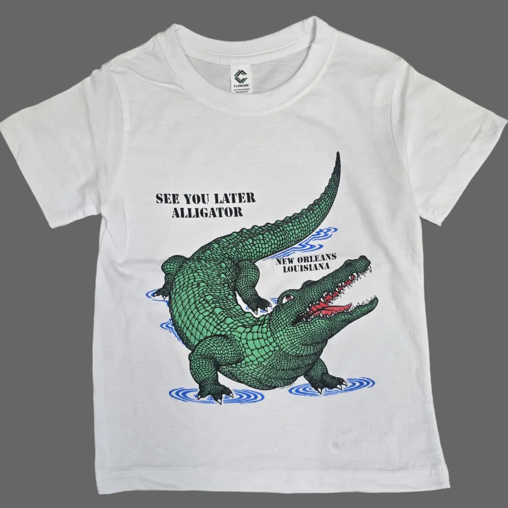 A white short-sleeve kids' t-shirt featuring a green alligator graphic with the text 'SEE YOU LATER, ALLIGATOR' and 'NEW ORLEANS LOUSIANA' on a white background